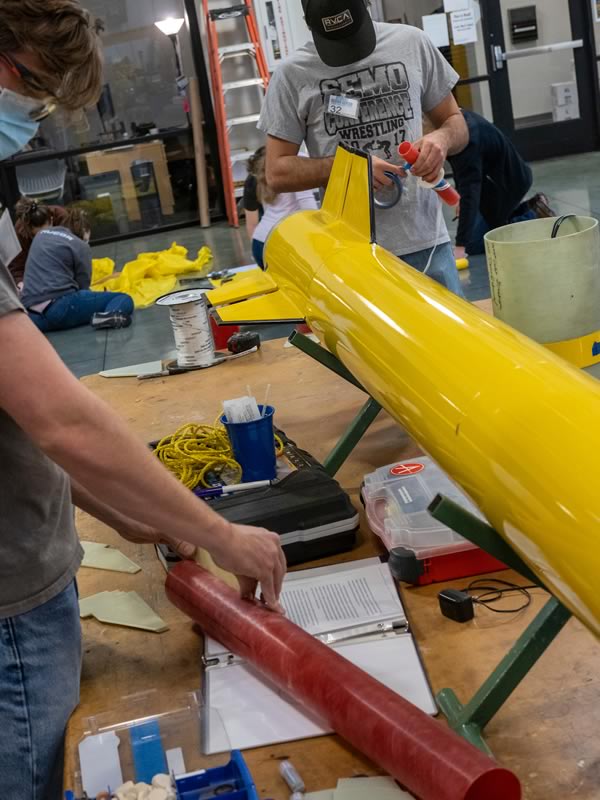 Students construct a rocket at the Student Design Center